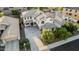 An aerial view of a home featuring a long driveway, desert landscaping, and solar panels on the roof at 2556 E Quiet Hollow Ln, Phoenix, AZ 85024