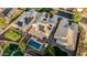 Overhead view showcasing a backyard with a private pool, covered patio, and eco-friendly solar panels on the roof at 2556 E Quiet Hollow Ln, Phoenix, AZ 85024