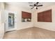 Bonus room offers tile floors, outdoor access, and a ceiling fan for added comfort at 2556 E Quiet Hollow Ln, Phoenix, AZ 85024