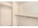 This walk in closet features metal rods and shelving for storing clothing at 2556 E Quiet Hollow Ln, Phoenix, AZ 85024