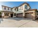 Charming two-story home with a three-car garage, beautiful windows, and a well-maintained yard at 2556 E Quiet Hollow Ln, Phoenix, AZ 85024