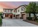 Charming two-story home with a three-car garage, beautiful windows, and a well-maintained yard at 2556 E Quiet Hollow Ln, Phoenix, AZ 85024