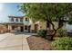 Charming two-story home with a three-car garage, beautiful windows, and a well-maintained yard at 2556 E Quiet Hollow Ln, Phoenix, AZ 85024