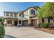 Charming two-story home with a three-car garage, beautiful windows, and a well-maintained yard at 2556 E Quiet Hollow Ln, Phoenix, AZ 85024