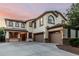 Charming two-story home with a three-car garage, beautiful windows, and a well-maintained yard at 2556 E Quiet Hollow Ln, Phoenix, AZ 85024