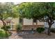 Well-maintained front yard with lush landscaping and decorative stone accents at 2556 E Quiet Hollow Ln, Phoenix, AZ 85024