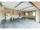 Spacious garage with lots of room for storage and built in shelves at 2556 E Quiet Hollow Ln, Phoenix, AZ 85024
