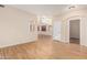 Spacious open-concept living area with wood-look floors and lots of natural light at 2556 E Quiet Hollow Ln, Phoenix, AZ 85024