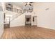 Spacious, two-story living room featuring a staircase, balcony, and wood-look floors at 2556 E Quiet Hollow Ln, Phoenix, AZ 85024