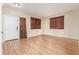 Bright living room featuring wood-look floors, natural light, and neutral paint at 2556 E Quiet Hollow Ln, Phoenix, AZ 85024