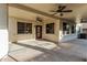 Spacious covered patio with ceiling fans, providing a comfortable outdoor living space at 2556 E Quiet Hollow Ln, Phoenix, AZ 85024