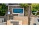 A high angle view showcases a rectangular blue pool with minimal desert landscaping and gravel surroundings at 2556 E Quiet Hollow Ln, Phoenix, AZ 85024