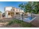 Spacious backyard with pool, covered patio, and secure fencing for outdoor enjoyment and entertaining at 2556 E Quiet Hollow Ln, Phoenix, AZ 85024