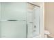 The bathtub shower is enclosed by a sliding glass door at 2556 E Quiet Hollow Ln, Phoenix, AZ 85024