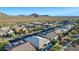 Residential neighborhood showcasing desert landscaping and single Gathering homes with tile roofs and mountain views at 2618 E Stacey Rd, Gilbert, AZ 85298