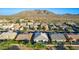 Desert community featuring single Gathering homes with tile roofs and mountain views in the distance at 2618 E Stacey Rd, Gilbert, AZ 85298