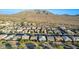 An expansive view of a desert community featuring numerous single Gathering homes and scenic mountain views at 2618 E Stacey Rd, Gilbert, AZ 85298