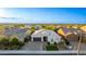 A charming home with desert landscaping, a two-car garage, and mountain views in a serene neighborhood at 2618 E Stacey Rd, Gilbert, AZ 85298