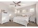 Comfortable bedroom featuring neutral walls, ceiling fan, carpet and bed with storage plus matching dressers at 2618 E Stacey Rd, Gilbert, AZ 85298