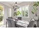 Elegant dining area with modern chandelier lighting and neutral-toned decor at 2618 E Stacey Rd, Gilbert, AZ 85298