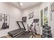 Exercise room with a treadmill, stationary bike, and weight rack, perfect for a home gym at 2618 E Stacey Rd, Gilbert, AZ 85298