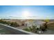 A charming home with desert landscaping, a two-car garage, and mountain views in a serene neighborhood at 2618 E Stacey Rd, Gilbert, AZ 85298