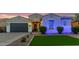 Charming single-story home featuring a well-maintained lawn, desert landscaping and a two car garage at 2618 E Stacey Rd, Gilbert, AZ 85298