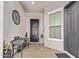 Inviting front porch featuring a cozy bench, welcome decor, and stylish accents at 2618 E Stacey Rd, Gilbert, AZ 85298