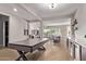 Elegant game room transitions seamlessly into the living space with a sophisticated pool table at 2618 E Stacey Rd, Gilbert, AZ 85298