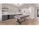 Stylish game room features a modern pool table, custom bar, and elegant decor at 2618 E Stacey Rd, Gilbert, AZ 85298
