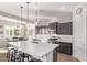 Bright kitchen featuring stainless appliances, a large island with seating, and modern lighting at 2618 E Stacey Rd, Gilbert, AZ 85298