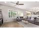 Inviting living area featuring a comfortable sectional sofa and bright natural light at 2618 E Stacey Rd, Gilbert, AZ 85298