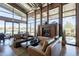 Comfortable living room seating area with a cozy fireplace and views of the lake at 2618 E Stacey Rd, Gilbert, AZ 85298