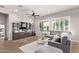 Bright living room with plush seating, plantation shutters, and contemporary decor at 2618 E Stacey Rd, Gilbert, AZ 85298