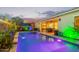 A well-maintained backyard pool with a covered patio and outdoor seating, ideal for enjoying sunny days and outdoor entertaining at 2618 E Stacey Rd, Gilbert, AZ 85298
