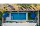 Aerial view of a sparkling pool with lounge chairs and umbrellas in a well-designed backyard at 2618 E Stacey Rd, Gilbert, AZ 85298
