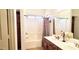 Bathroom with double sinks, a vanity, and a shower/tub combo at 2894 N Paisley Ave, Casa Grande, AZ 85122