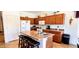 Well-equipped kitchen featuring an island with seating, stainless steel appliances, and ample cabinet space at 2894 N Paisley Ave, Casa Grande, AZ 85122