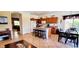 Well-lit kitchen features a central island with barstool seating and wood cabinetry at 2894 N Paisley Ave, Casa Grande, AZ 85122