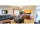 Inviting living room with plush sofas, a coffee table, and a decorative sunset painting at 2894 N Paisley Ave, Casa Grande, AZ 85122