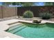 Beautiful pool with steps, concrete surround, and well-kept landscaping at 2894 N Paisley Ave, Casa Grande, AZ 85122
