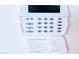 Image of a security system panel on the wall, displaying date and time at 2894 N Paisley Ave, Casa Grande, AZ 85122