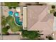 An aerial view showcases the expansive backyard oasis, pool, outdoor kitchen, and meticulously landscaped yard at 35952 W Catalonia Dr, Maricopa, AZ 85138