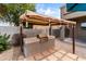 This outdoor kitchen features a built-in grill and prep area, perfect for outdoor cooking and entertaining at 35952 W Catalonia Dr, Maricopa, AZ 85138