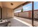 Enclosed back patio with concrete slab and gravel, providing a private outdoor space at 440 S Parkcrest -- # 145, Mesa, AZ 85206