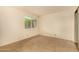 This bedroom features neutral walls, tile flooring, and a bright window at 440 S Parkcrest -- # 145, Mesa, AZ 85206
