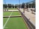 Community bocce ball court featuring artificial turf and surrounding seating areas, providing a recreational space for residents at 440 S Parkcrest -- # 145, Mesa, AZ 85206