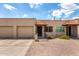 Charming single-story townhome with a well-manicured front yard and a private garage, featuring desert landscaping at 440 S Parkcrest -- # 145, Mesa, AZ 85206