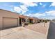 Charming single-story townhomes featuring private garages, well-manicured yards, and desert landscaping at 440 S Parkcrest -- # 145, Mesa, AZ 85206