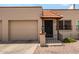 Charming home featuring a decorative tile roof over the front entryway and a single-car garage on the left side at 440 S Parkcrest -- # 145, Mesa, AZ 85206